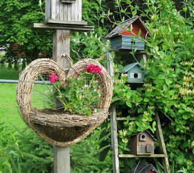 how to grow your garden with junk, flowers, gardening, outdoor living, repurposing upcycling, I call the ladder filled birdhouses the Birdie Hotel Sadly the bees generally book the pent house