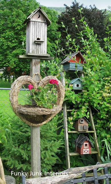 how to grow your garden with junk, flowers, gardening, outdoor living, repurposing upcycling, I call the ladder filled birdhouses the Birdie Hotel Sadly the bees generally book the pent house