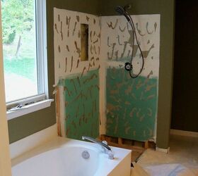 builder s grade bathroom turned to showcase space, bathroom ideas, home decor, home improvement, The cultured marble wall panels and base were leaking and removed