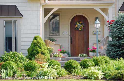 landscaping around your porch, curb appeal, flowers, landscape, A close up of the porch not only shows the sweet arched door but how the plants and flowers lead your eye to it