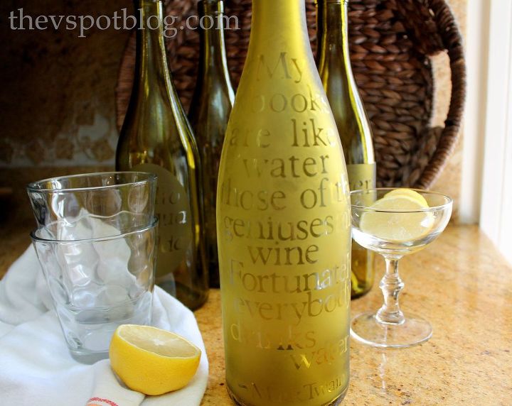 upcycling empty wine bottles into etched water carafes, crafts, I found quotations about water or the word water in different languages and I was able to etch them just using contact paper stencils and the glass etching cream