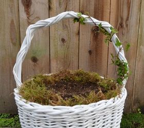 fairy garden easter baskets, crafts, easter decorations, gardening, seasonal holiday decor, Line the basket with a 1 inch layer of sphagnum moss Fill the basket with a high quality potting soil Then plant a small leafed ivy wrapping the ivy around the handle and tying it down with clear fishing line