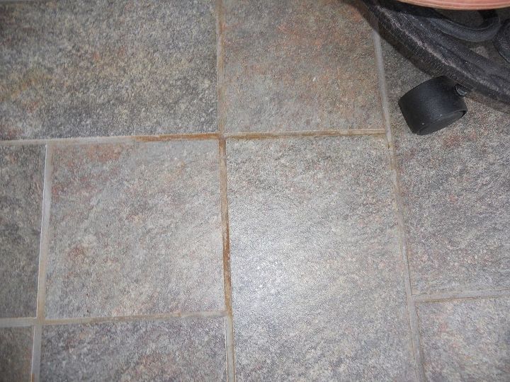 how do i get rust off of tile and grout outside, This is my rust stain still no answer to what to use Need something that won t take the gray color out HELP