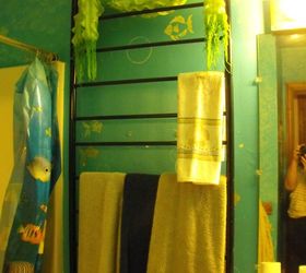 my son s upcycled crib, painted furniture, repurposing upcycling, The crib springs went to make a towel rack in the kids ocean themed bathroom Looks like the ladder on a boat don t you think