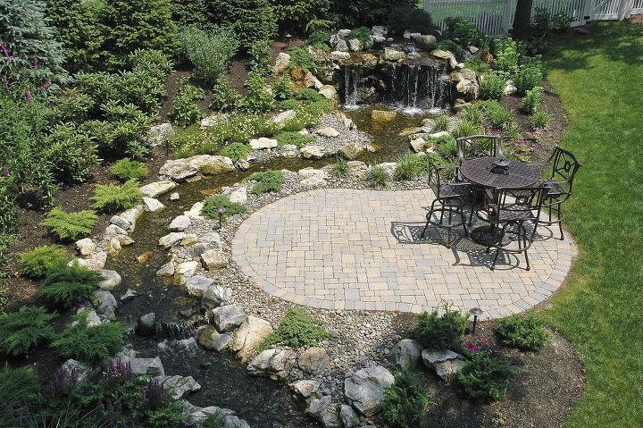 fun beautiful and safe for kids think pondless waterfall and stream, Waterfall and stream are viewed from this patio lounging space
