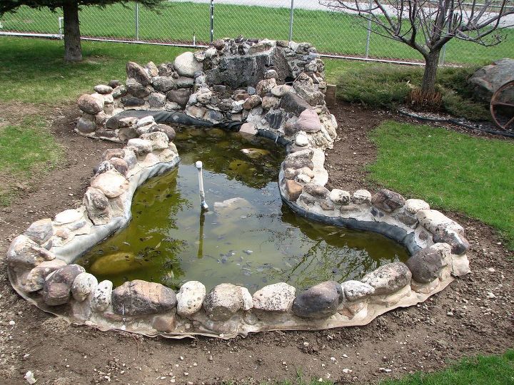 q our front yard pond and other projects, concrete masonry, decks, landscape, outdoor living, ponds water features, This is the pond in front of our house Built by previous owners Fun but dirty w the trees surrounding