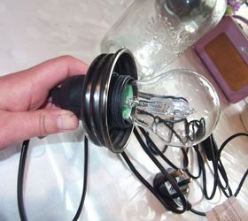 diy tutorial jar pendant swag light, diy, how to, lighting, Fit the cord kit through the hole in the lid secure then add light bulb you are now ready to screw onto jar
