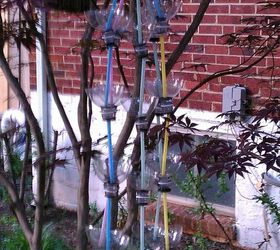 recycled soda bottles as hanging seedling rain chains, This is all 5 of the rain chains hanging together in my Japanese Maple tree They are hung on a white plastic clothes hanger