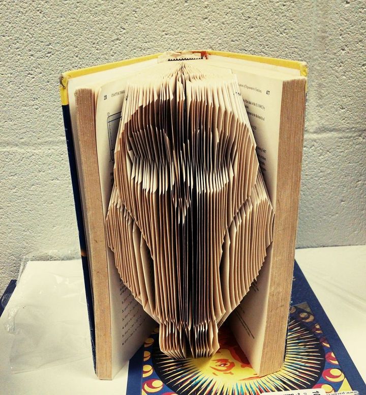 DIY book folding art with an owl design