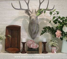 how to create a summertime mantel for free, flowers, home decor, Buck looks over a mantel filled with lacy white blossoms white farmhouse pitchers and pink and white Stafforshire dishes