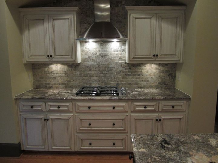 wow what a change for this kitchen, home decor, home improvement, kitchen backsplash, kitchen design, kitchen island, We choose to take the tile above and around the tops of the cabinets Added a stainless hood and DCS 30 gas stove