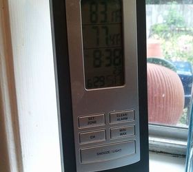 greenhouse built for less than 700, diy, gardening, outdoor living, Remote weather station in my kitchen window Top temp tells me what it is in greenhouse Ran extension cord and placed small heater inside with timer for winter Easy to adjust temp with MS winter weather that flucuates