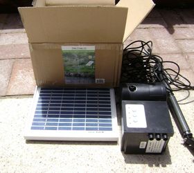 marie s tipsy solar fountain, container gardening, crafts, gardening, ponds water features, repurposing upcycling, Solar pump kit attaches to plastic tubing running through all the buckets Link in the post to find this on Amazon Sun power It works great even with a set up this tall