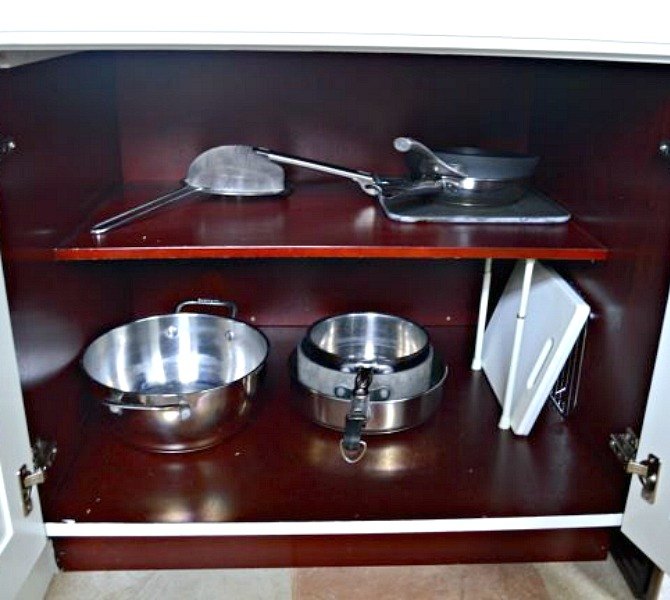 s 13 incredibly useful tension rod ideas you haven t seen yet, crafts, organizing, repurposing upcycling, Organize your kitchen cabinets