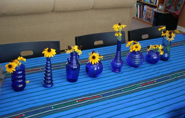 heavenly cobalt glass in the garden, crafts, outdoor living, repurposing upcycling, Cobalt glass vases are brilliant with gold and yellow flowers this centerpiece was for a garden club meeting