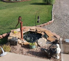 our new pond, outdoor living, ponds water features, The pond is done but we need to finish moving gravel around I now have 4 fish A raccoon has helped himself So we borrowed a trap I m hoping to relocate him far far away real soon