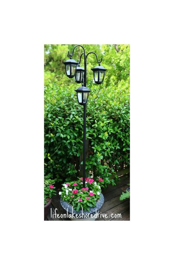 easy diy solar lights lamp post with flower planter, go green, landscape, lighting, outdoor living, I placed a steel rod in Quikrete as my base You can check out the steps on my blog