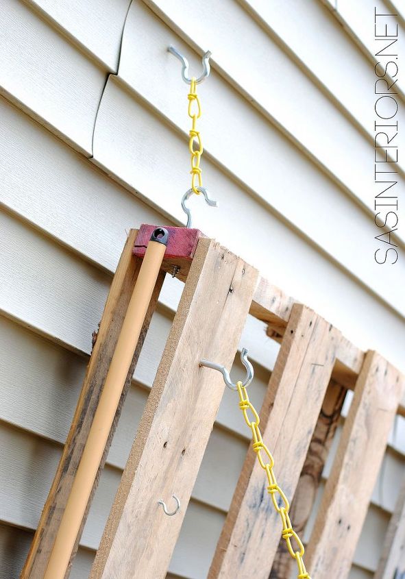 diy pallet gardening table, diy, gardening, how to, outdoor furniture, outdoor living, painted furniture, pallet, repurposing upcycling, The pallet garden table is hung from the side of my home using heavy duty C Shaped Screws