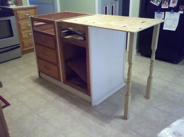 old base cabinets repurposed to kitchen island, Getting an idea of how the legs will look and how far to have the top extend from the cabinets