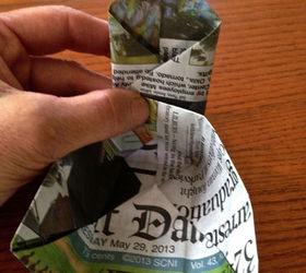 origami paper seedling pots from newspaper, Do the same thing on the right side folding the right corner across as show and reverse the crease line again You now have a pointed tab at the top and two corners to the box
