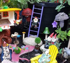 garden walk fairies gnomes and flower garden design, flowers, gardening, outdoor living, repurposing upcycling, The Gnome Garden made with toys is a delightful surprise as you walk along the flower beds