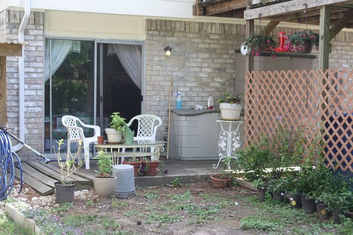 backyard fix up messy corners, concrete masonry, decks, outdoor furniture, outdoor living, patio, The original stage one picture the year I added the furniture and plumbego bed