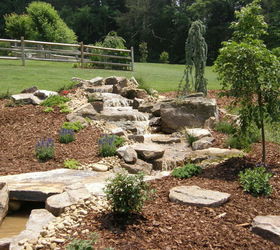 davidson n c pondless waterfall, ponds water features, The pondless waterfall is accentuated by colorful perennials and unique specimen plantings
