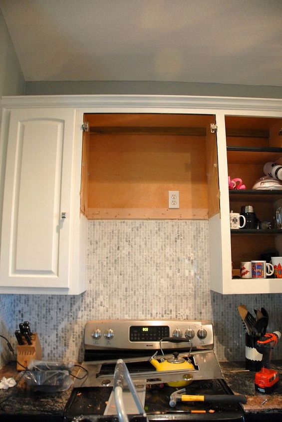 custom range hood for under 50, The demoed out cabinet Let me add since I had a comment about the mess on the stove the stove is broken My husband cracked it and I only have one functioning burner When you do this remove the stove or at least cover it