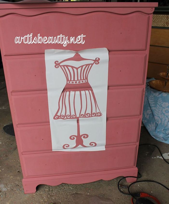 discarded dresser turned dress form beauty, painted furniture, I mixed up a custom deep Pinkish red Then using my silhouette cut out this dress form stencil I am not going to lie Placing this stencil was a pain lots of small vinyl pieces I thought should have just free handed it on