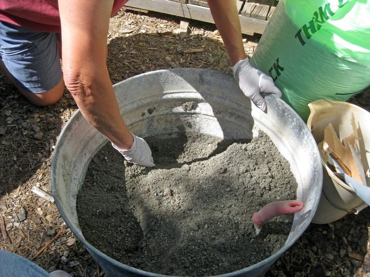 how to make an easy stepping stone, concrete masonry, diy, how to, outdoor living, First call a friend to play with Then mix concrete in a tub use gloves Add enough water to make it like brownie batter Laugh a LOT