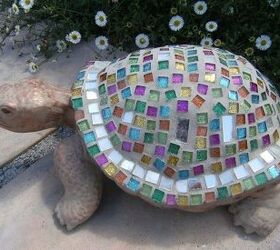 garden creatures, gardening, A closer inspection of Joseph s coat He was made using a store purchased ceramic mold to which I added small mosaics in jewel tones with some mirror tiles The head and feet were painted with bronze craft paint