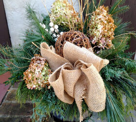 nature inspired holiday decor, christmas decorations, seasonal holiday decor, wreaths, Using what I had on hand and adding some natural elements like burlap ribbon and a grapevine ball gave the urns by the front door a natural casual look