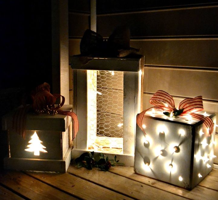 make pretty light up wooden presents for your porch, lighting, porches, seasonal holiday decor, The trio of presents lights up at night