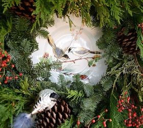 potting shed christmas nesting feathering, christmas decorations, decks, gardening, seasonal holiday decor, wreaths, A live wreath needed some additional feathering so I cut some berries and Leyland Cypress to add some fullness and frame to plate on the door along with a clip on bird ornament