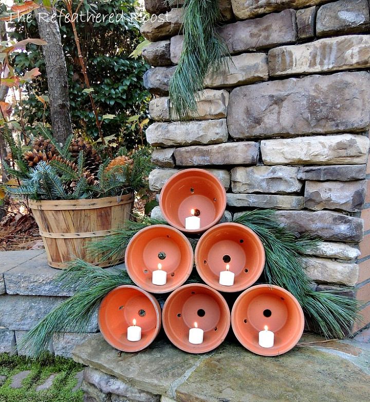 clay pot christmas tree, christmas decorations, outdoor living, seasonal holiday decor, Simply stack 6 clay pots and add candles I added a little pine to add to the tree look