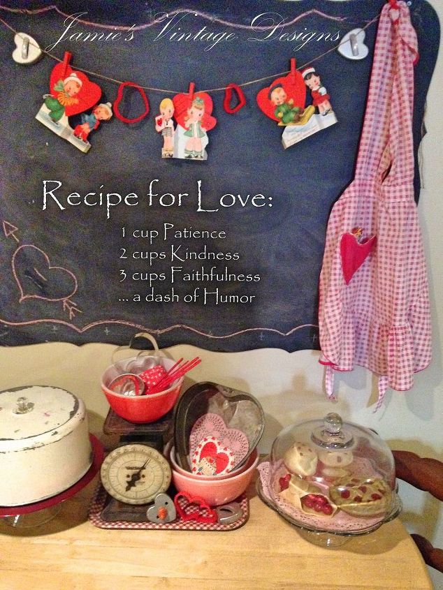 a vintage valentine s kitchen display, repurposing upcycling, seasonal holiday d cor, valentines day ideas, I used several vintage items such a this metal cake top vintage scale vintage apron vintage Mixing bowls and cookie cutters to make this display