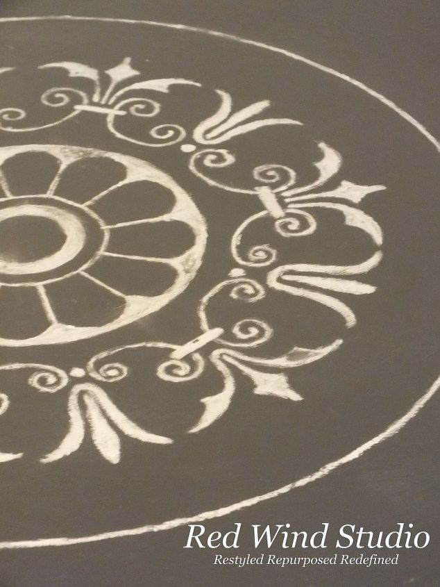 dressing it up the uses of gilding wax, painted furniture, Painting a design on a table is another way to use the wax I traced the image I wanted onto the table using chalk on the back of the paper then laying it on the table I then traced the image using a pencil When I lift the paper I have the image in chalk on the table which easily wipes away when I am done I then painted the image over the chalk outline I left the edges a little rough and did not apply it evenly I wanted the image to look worn I also added the silver gilding wax along the outer edge and skirt of the table