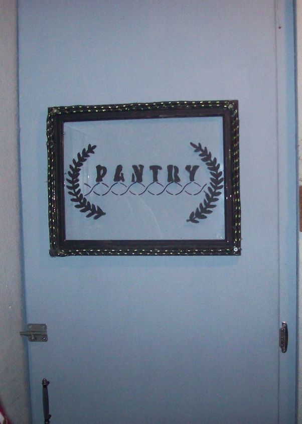 pantry door, cleaning tips, closet, doors, This is the finished door with a picture I traced on a picture frame glass with rope from dollar tree and hinges door handle and lock I bought at a 2nd hand store