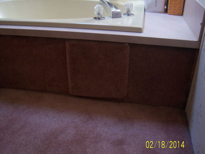 q help what do i do with the side of my bath tub, bathroom ideas, diy, home maintenance repairs, This is the way it looks now Square covering entry to water pipes doesn t show up as much as it looks in this picture though