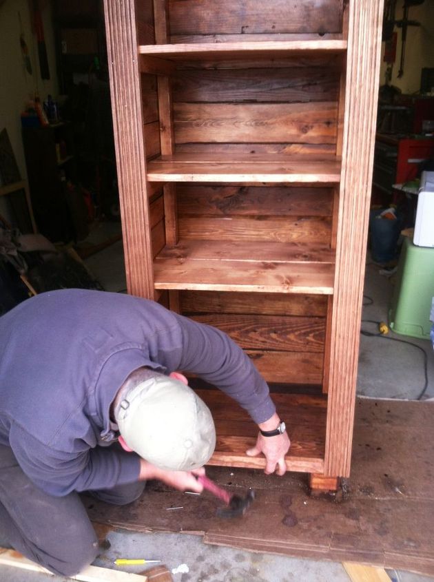 pallet wood converted to beautiful shelves, diy, pallet, shelving ideas, storage ideas, woodworking projects, We bought some trim from local hardware store to spruce up the front a bit Otherwise it was all FREE recycled pallet wood