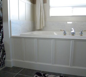 we updated our 90 s bathtub in one weekend with less than 200, After we added carerra marble and wood paneling