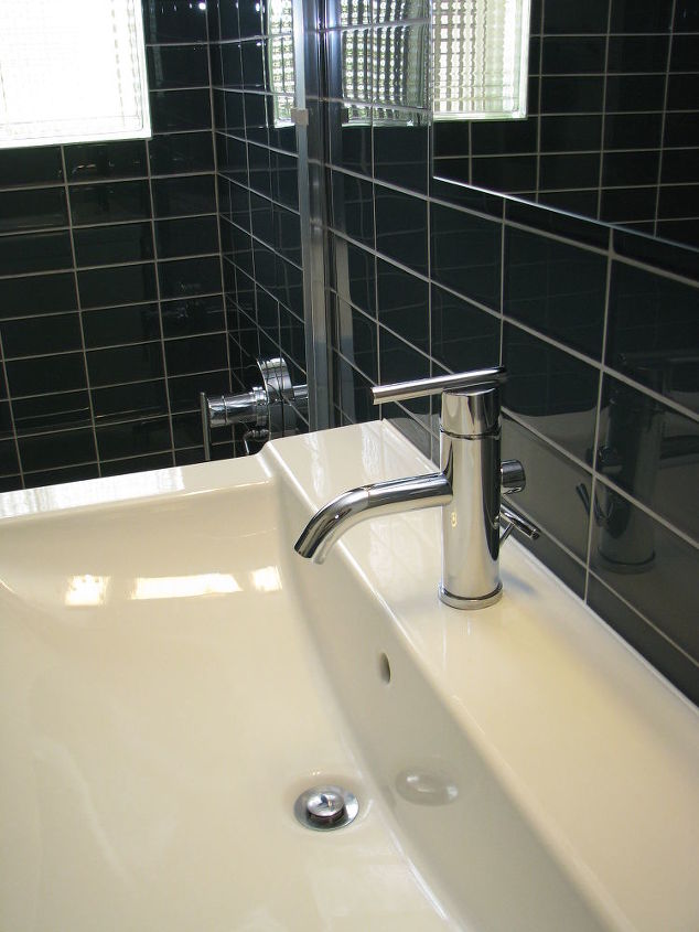 do you mind if i share a few photos of a mid century modern bathroom we remodeled, bathroom ideas, home decor, We reused this Ikea sink and faucet from the existing bathroom and accented them with new glass subway tile to create an updated look for this 50s bathroom