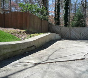 i really want to remove part of the retaining wall, Ground behing fence at end of driveway slopes down maybe 10 to the backyard