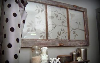 A design stencilled onto an old window makes one very pretty wall feature. Isn't this nice!?!