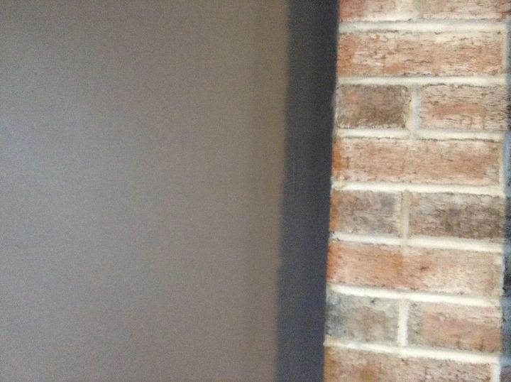 choosing tan wall color w whitewashed fireplace, Current color way too dark Looking for the perfect tan wall color to compliment this brick as well as dark hardwood floor dark brown sectional sofa