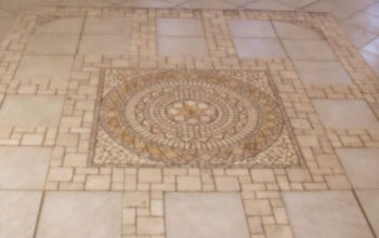 This is a heated stone tile floor in a sun room. I laied this floor from center out.