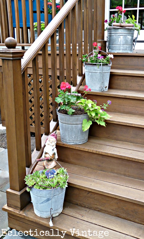 finally a good use for an old mop bucket anyone have other creative planter ideas, decks, gardening, Mop Bucket Planters in a Row Click link for more pics