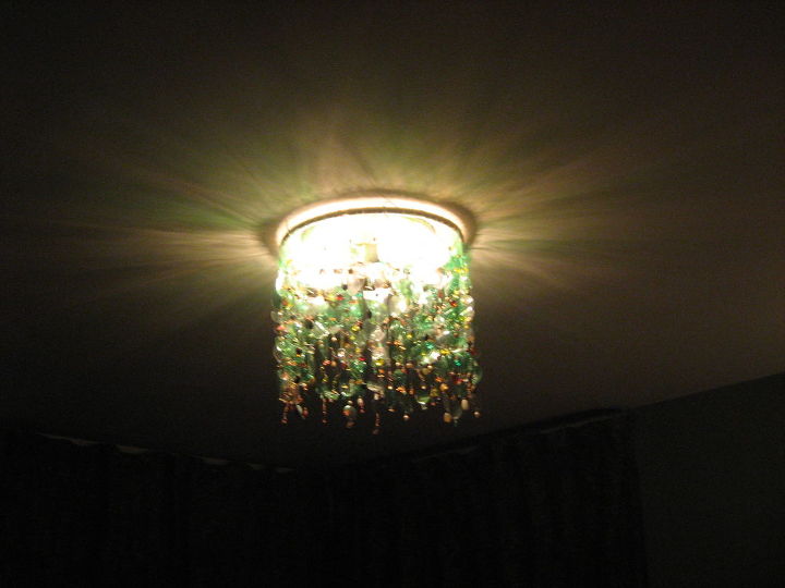 i wanted a chandalier but i wanted what i wanted so i made it i used water, lighting, repurposing upcycling