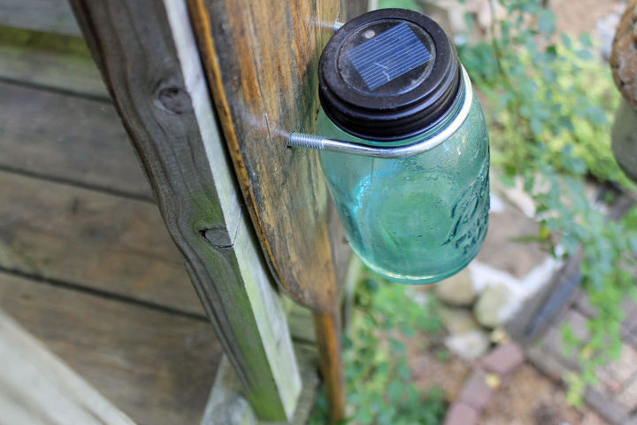 mason jar solar light on old oar, mason jars, outdoor living, repurposing upcycling