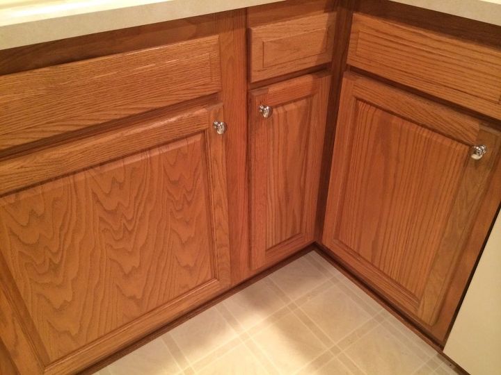 which hardwood with honey oak kitchen cabinets, Existing cabinets with linoleum floor Dishwasher corner visible